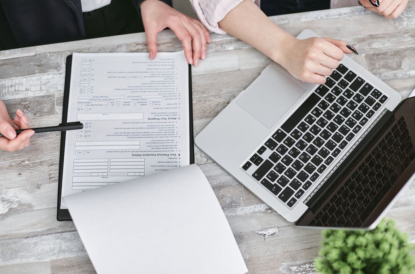 Legal documents and laptop reviewed by two people
